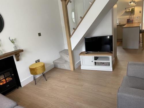 view showing cottage lounge, kitchen and stairs